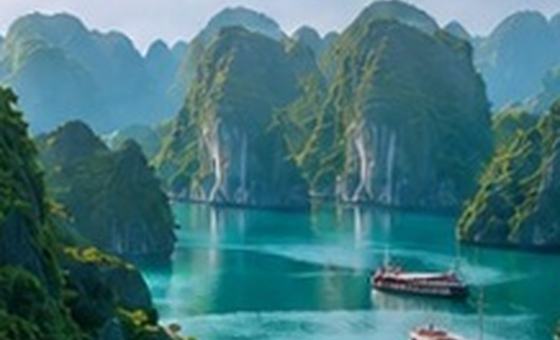 Limestone karsts rising from the water at Halong Bay